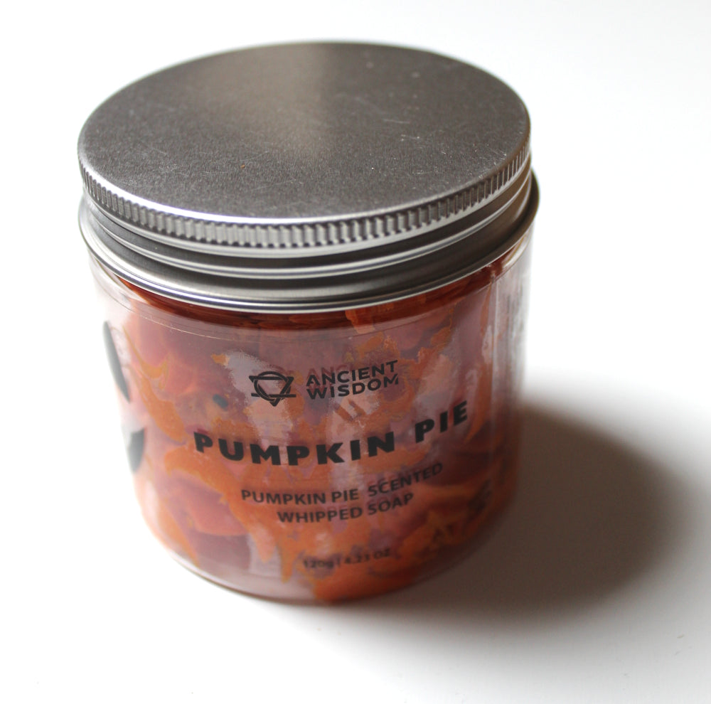 A clear jar of Ancient Wisdom Pumpkin Pie Scented Whipped Soap with a silver metal lid, set against a plain white background with a soft shadow.