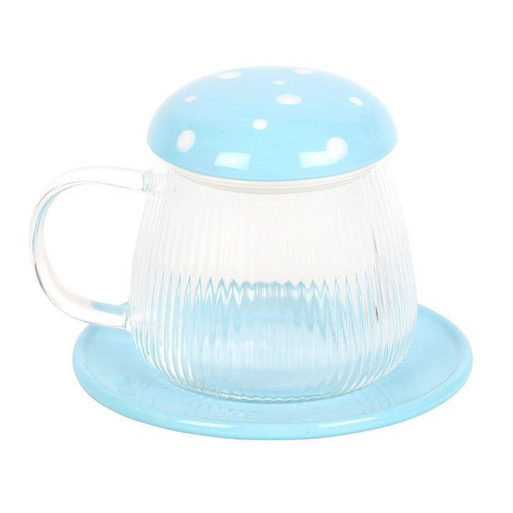 Clear glass mug with blue lid and base on a white background