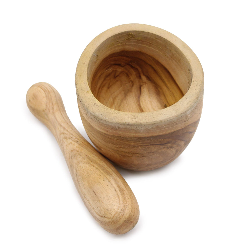 Wooden mortar and pestle on a white background