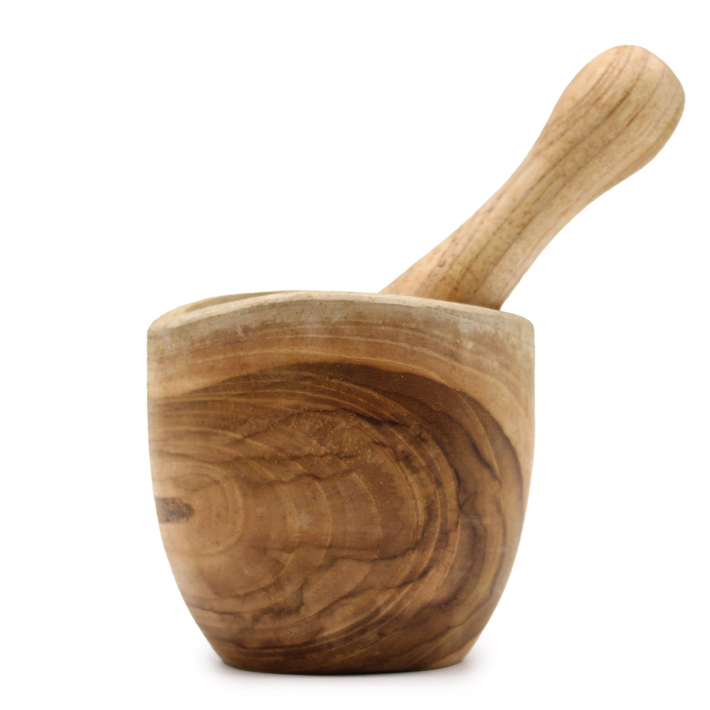Wooden mortar and pestle on a white background