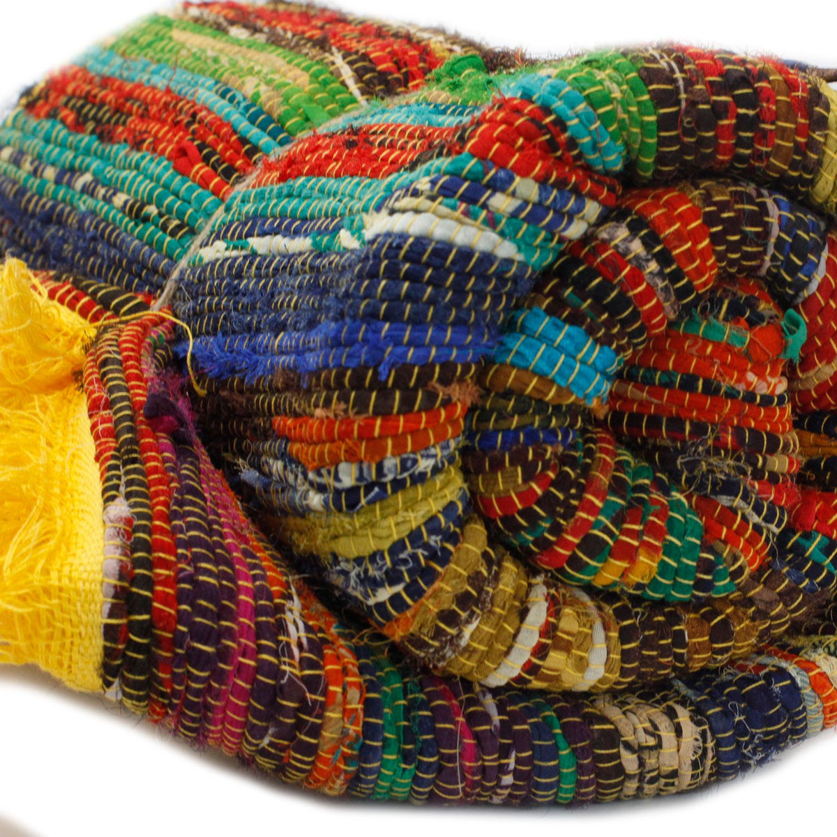Colorful woven fabric with a pattern of interwoven threads on a white background