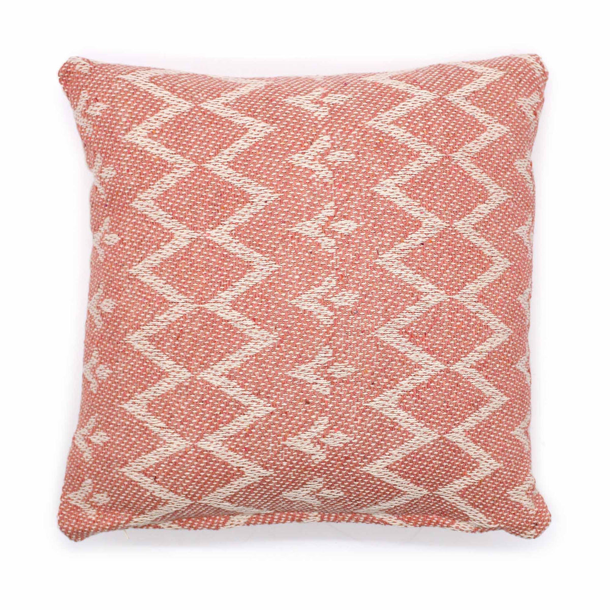 Pink and white patterned pillow on a white background