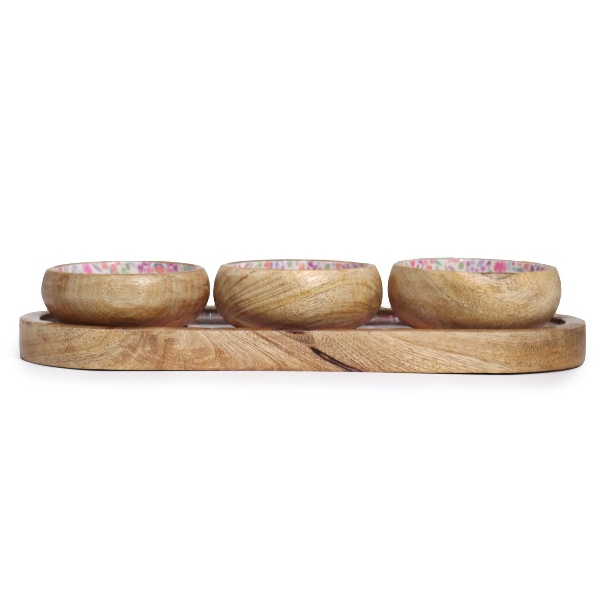 Set of three wooden bowls with floral patterns on a wooden tray against a white background