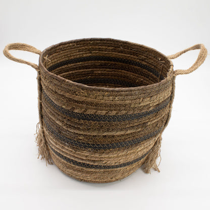 Woven basket with handles on a white background