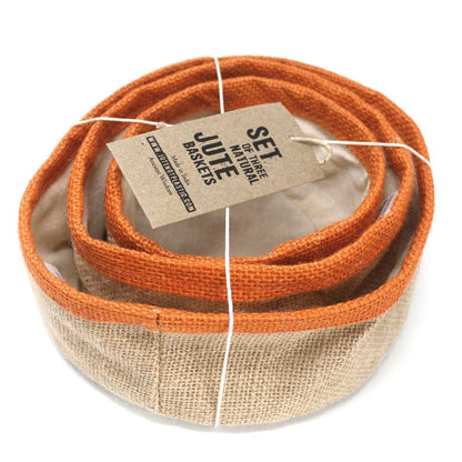Set of three jute baskets with an orange top layer and beige bottom layer, tied together with twine, on a white background.