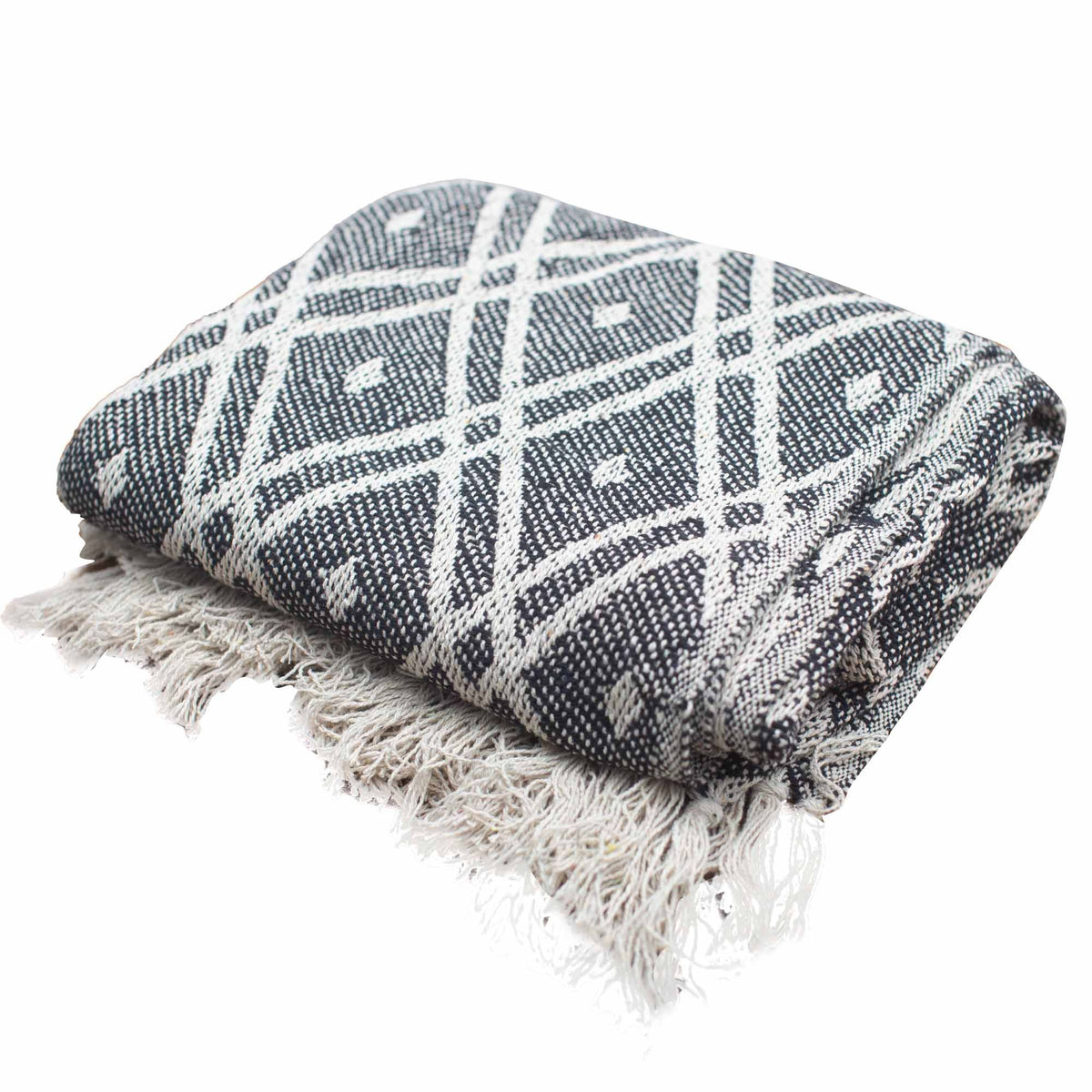 Woven blanket with geometric pattern and fringes on a white background