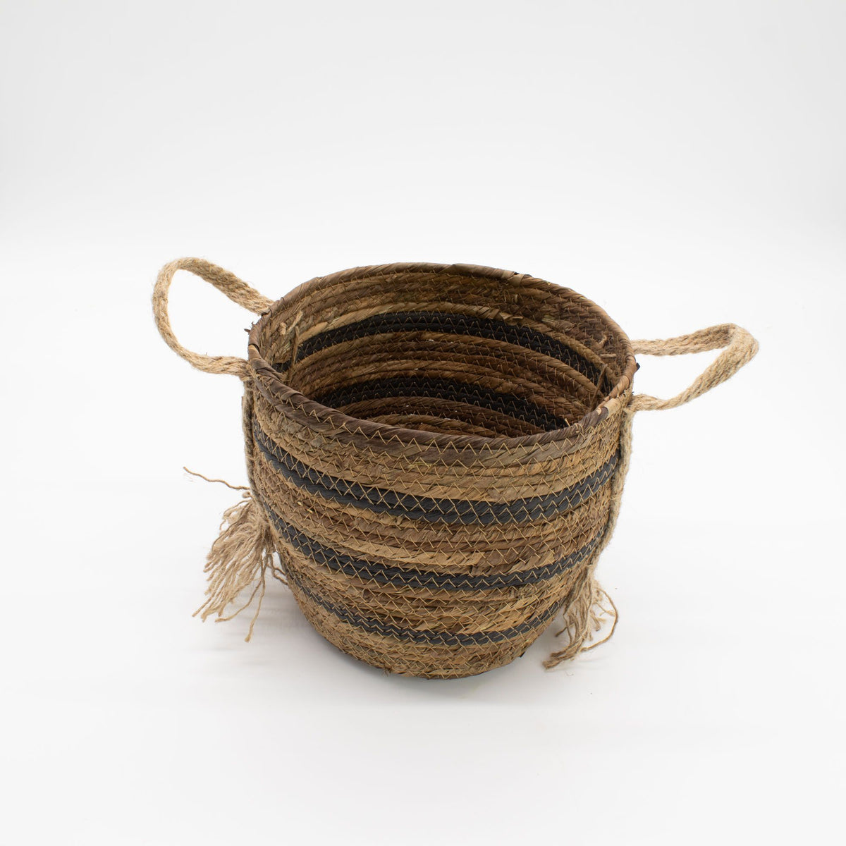 Woven basket with striped pattern on a white background