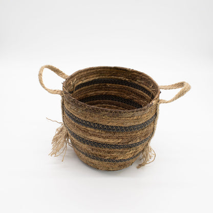 Woven basket with striped pattern on a white background