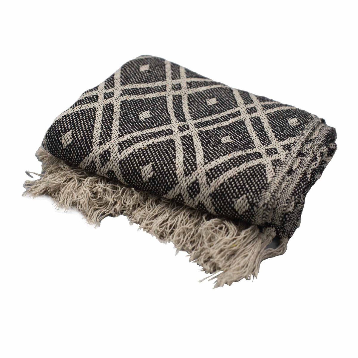 Black and white patterned throw blanket with fringes on a white background