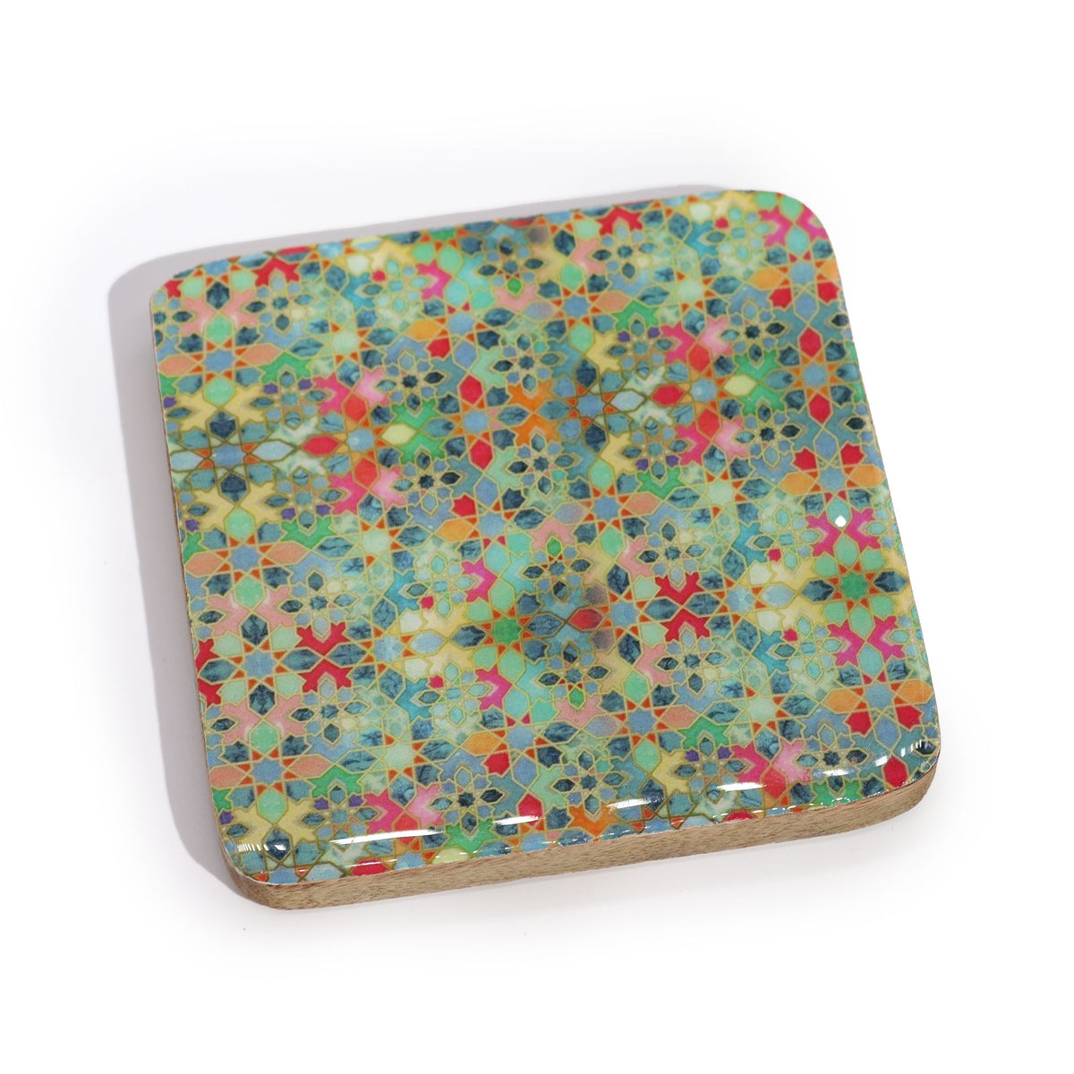 Colorful geometric patterned coaster on a white background