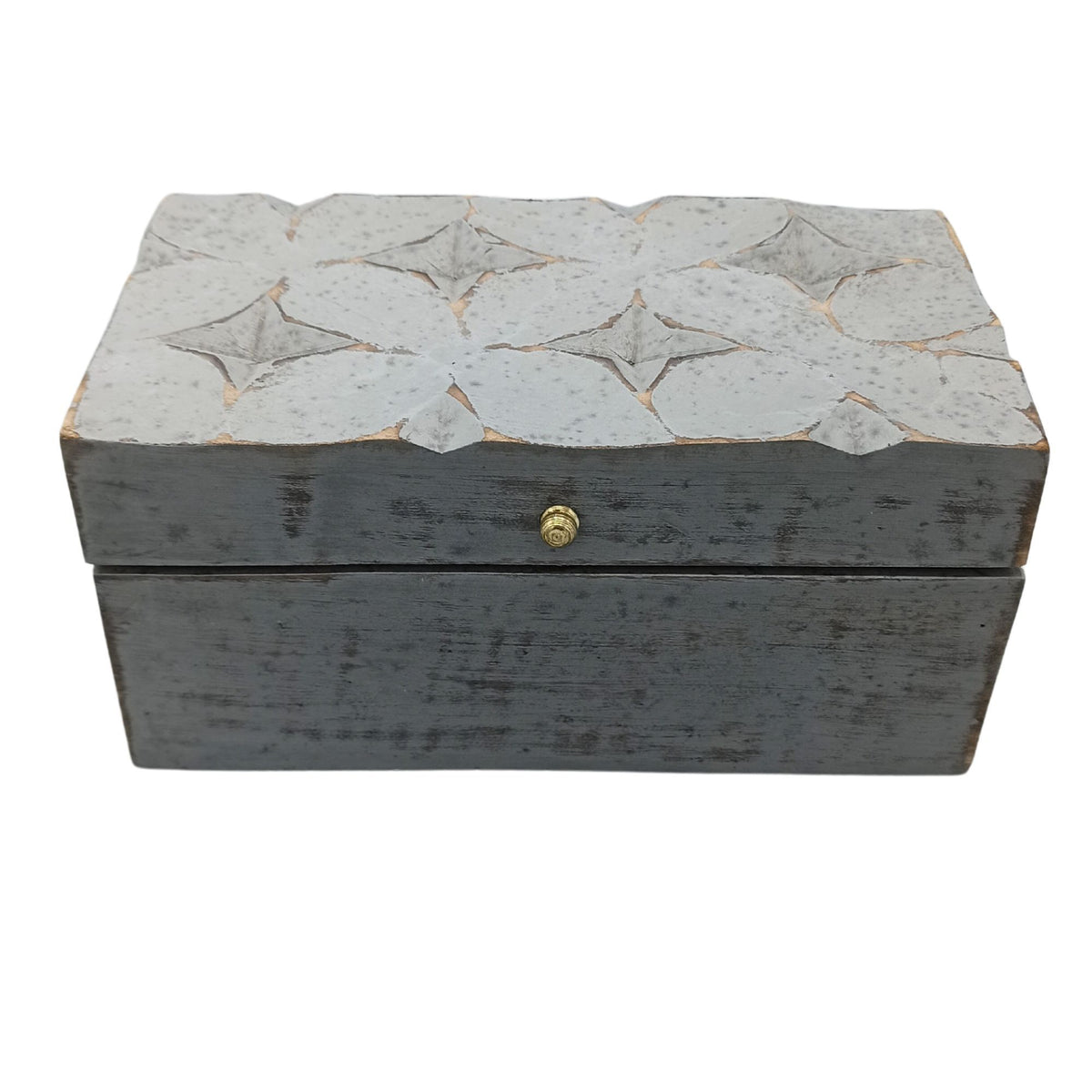Decorative wooden box with star patterns on a white background
