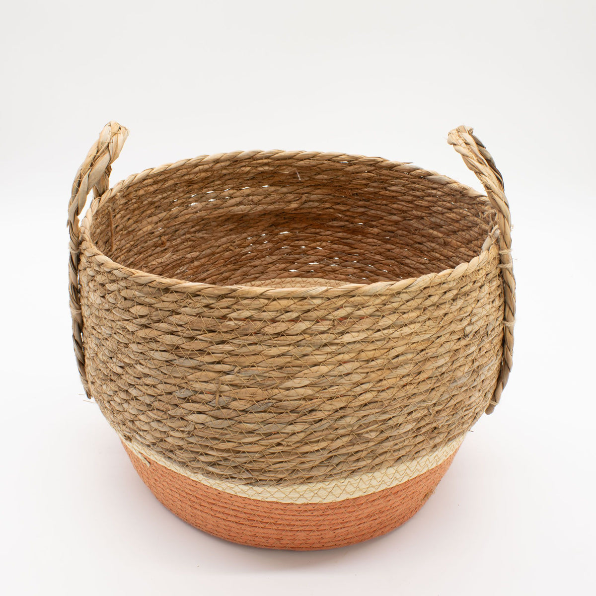 Woven basket with handles on a white background