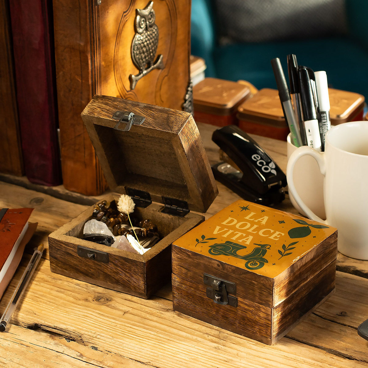Wooden box with decorative elements on a wooden surface