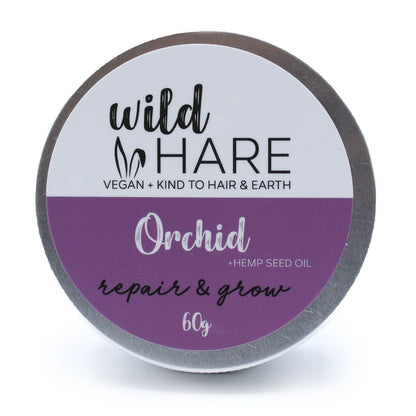 Container of 'Wild Hare' orchid repair and grow hair product on a white background