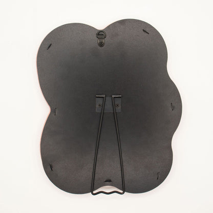 Back of a mirror Black pebble-shaped  on a white background