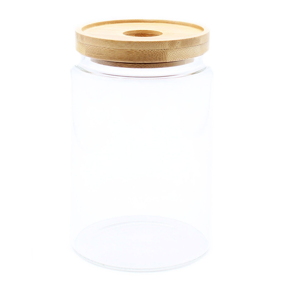 Clear glass jar with a wooden lid on a white background
