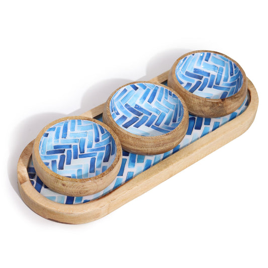 Set of three wooden bowls with blue geometric patterns on a matching wooden tray.