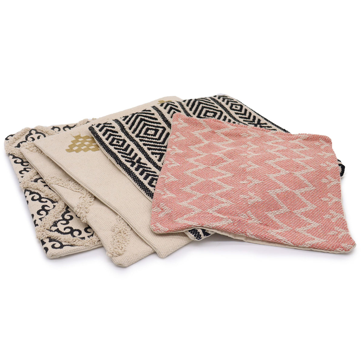 Set of four patterned cushion covers on a white background
