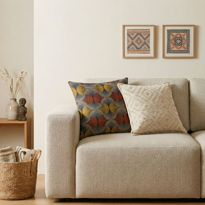 Beige sofa with patterned cushions in a living room setting