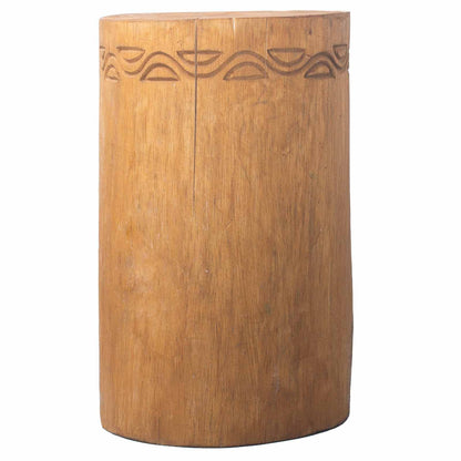 Wooden cylindrical stool with engraved design on a white background
