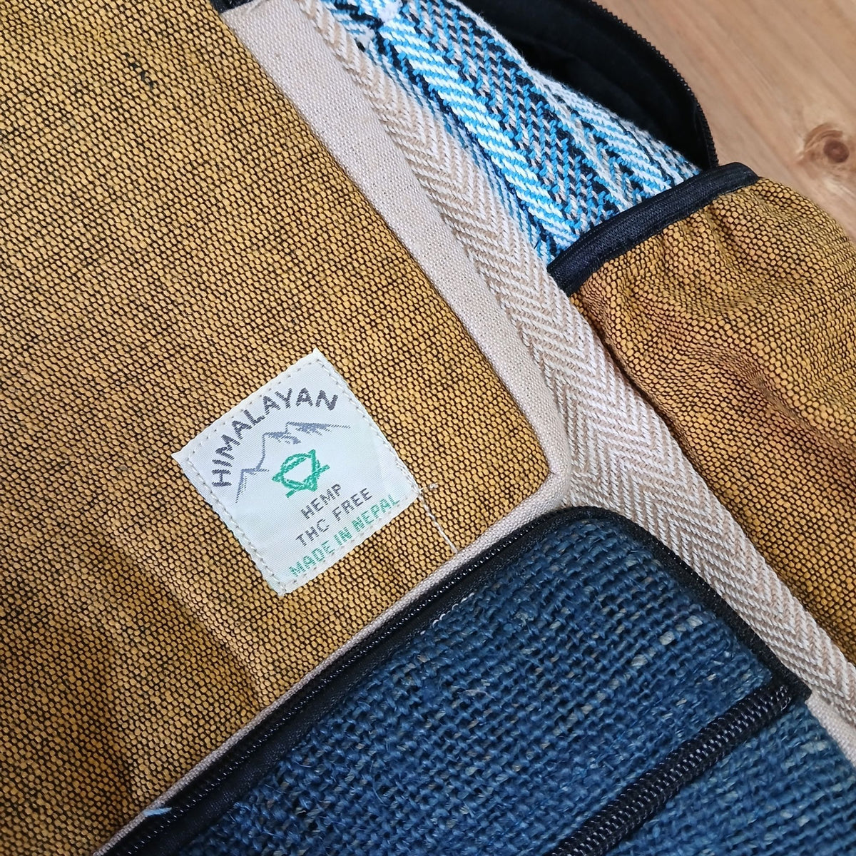 Close-up of a fabric product with a Himalayan Hemp label on a wooden surface