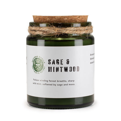 Candle jar labeled 'Sage & Mintwood' with a cork lid on a white background