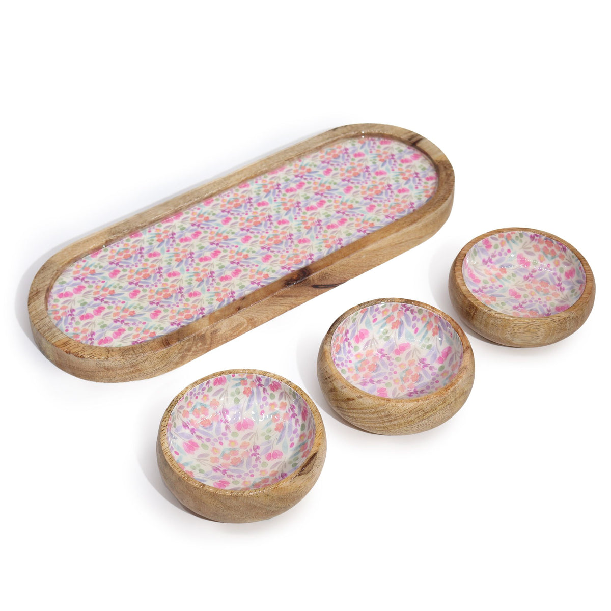 Set of wooden bowls with floral pattern on a white background