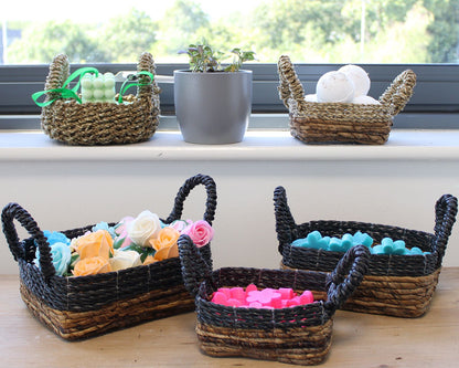 Wicker baskets with colorful items on a windowsill