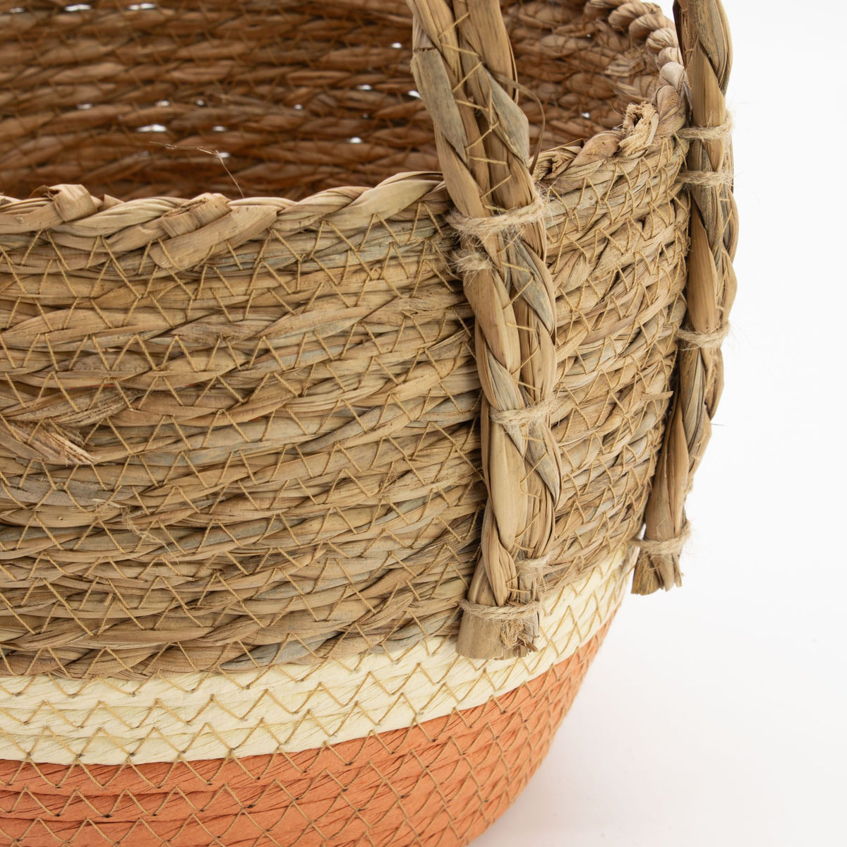 Close-up of a seagrass storage baskets woven basket with a white background