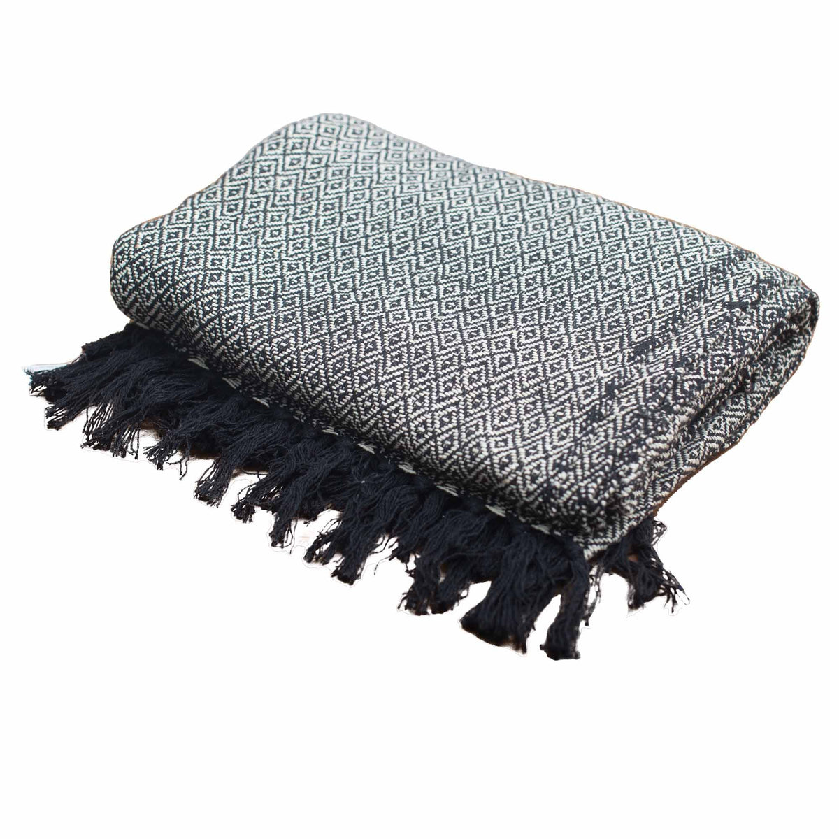 Textile with geometric pattern and black tassels on a white background