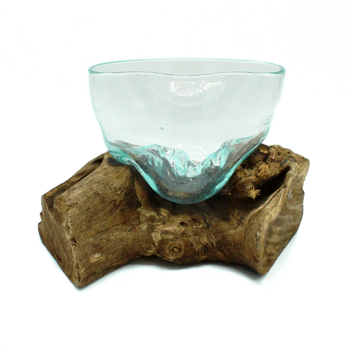 Clear glass bowl on a wooden base against a white background