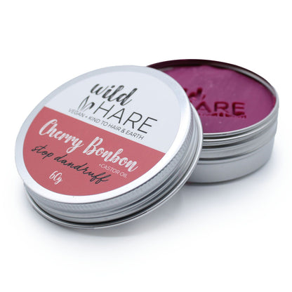 Open tin of Wild Hare Cherry Bonbon Solid Shampoo Bar hair product on a white background
