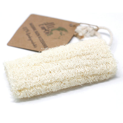 Natural loofah sponge with a hanging loop on a white background