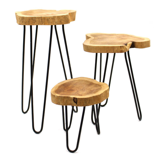 Set of three wooden side tables with black metal legs on a white background