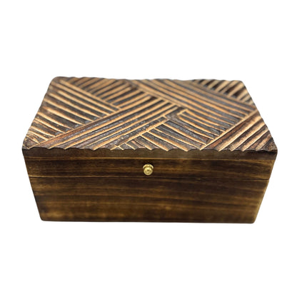 Wooden box with geometric pattern and gold clasp on a white background