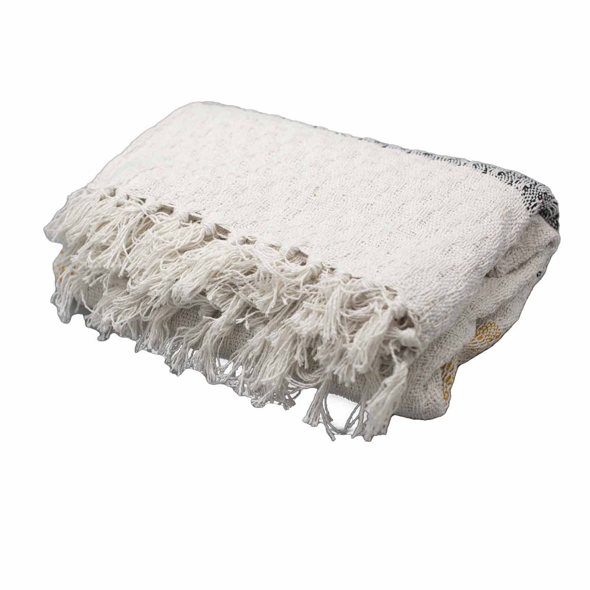 White blanket with fringes on a white background