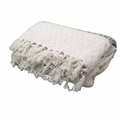 White blanket with fringes on a white background