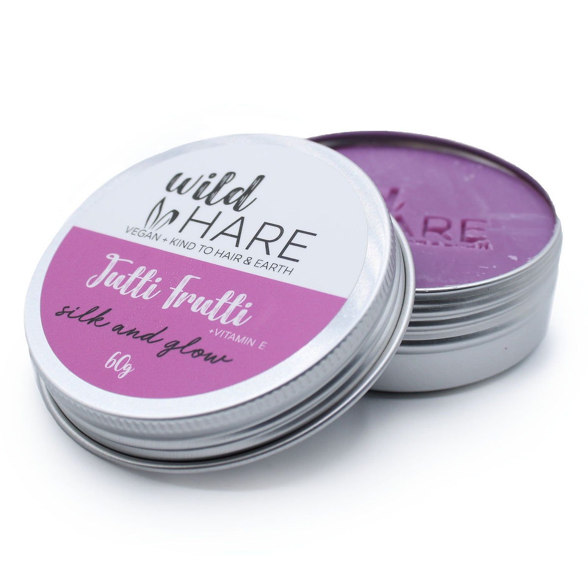 Open tin of 'Wild Hare' Tutti Frutti Solid Shampoo Bar on a white background