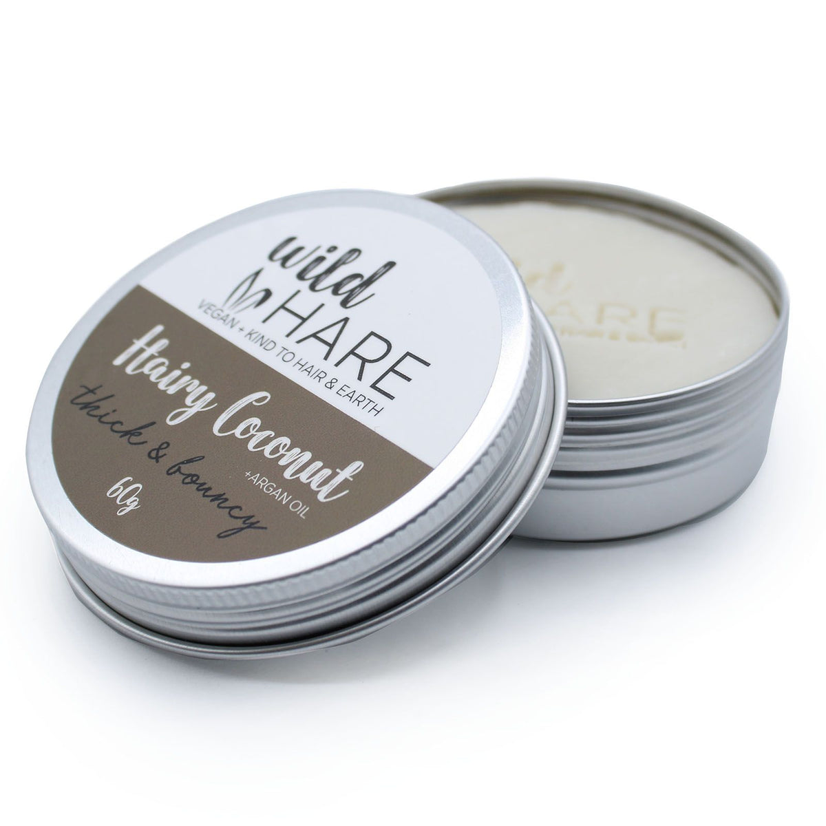 Tin of 'Hairy Coconut' hair Eco-Friendly Coconut Shampoo Bar by Wild Hare on a white background