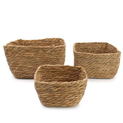 Three woven baskets of different sizes on a white background