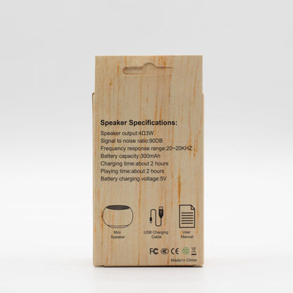 Wooden speaker packaging with specifications on a white background
