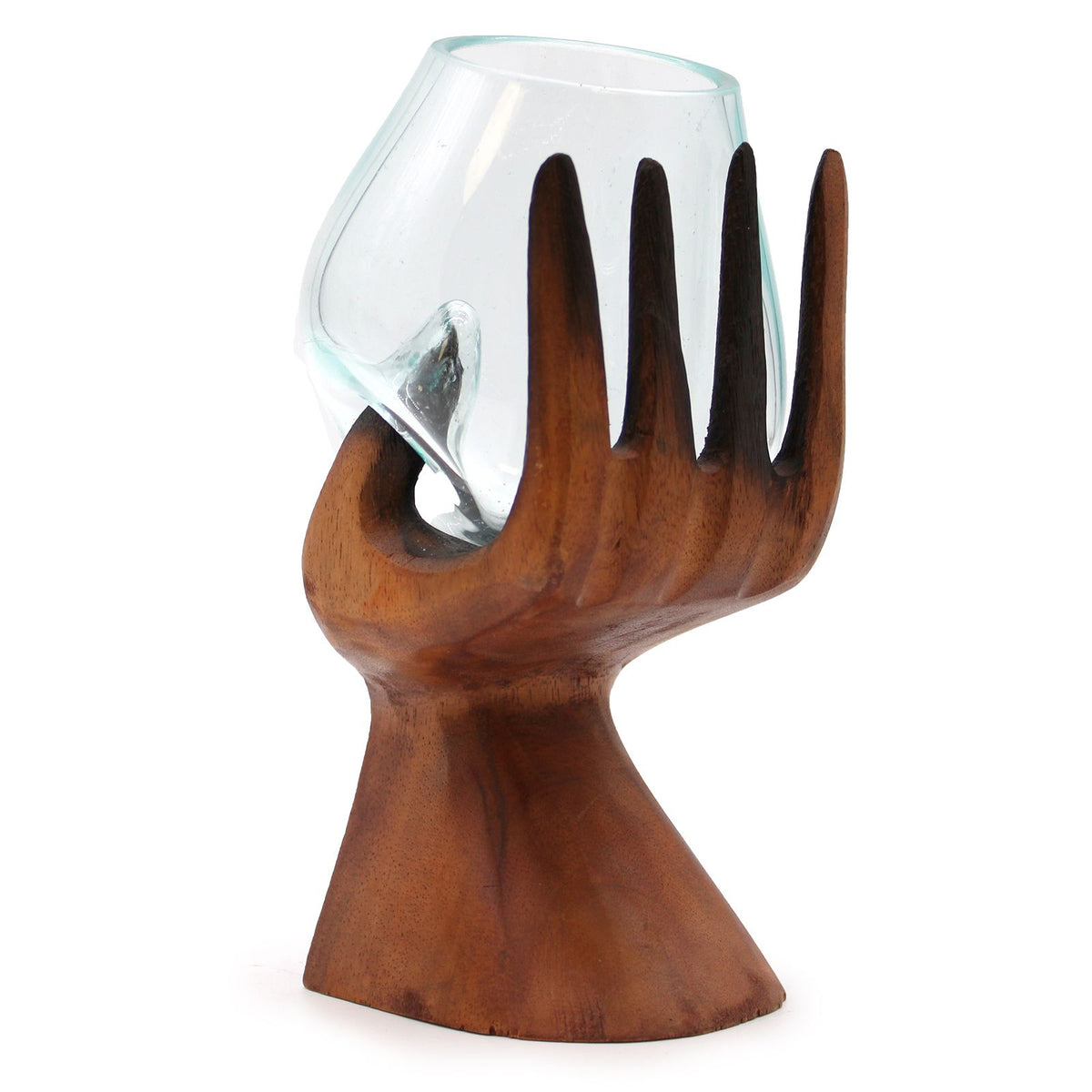 Wooden hand shaped holder with a glass inside on a white background