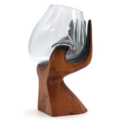 Wooden holder with a glass on a white background