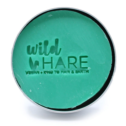 Inside Aloe Vera Solid Shampoo Bar container with 'wild HARE' green soap branding on a white background