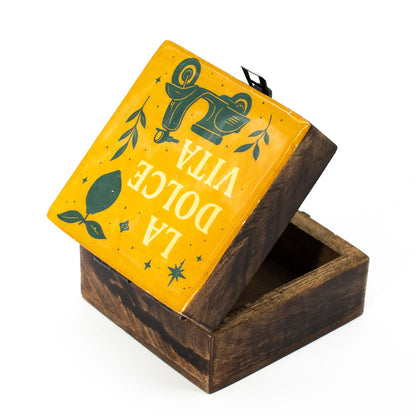 La Dolce Vita keepsake box Wooden box with a yellow lid featuring green text and graphics on a white background